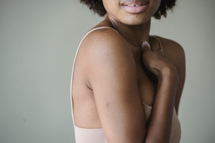 Soft natural light across calm skin, gentle long-term care mood.