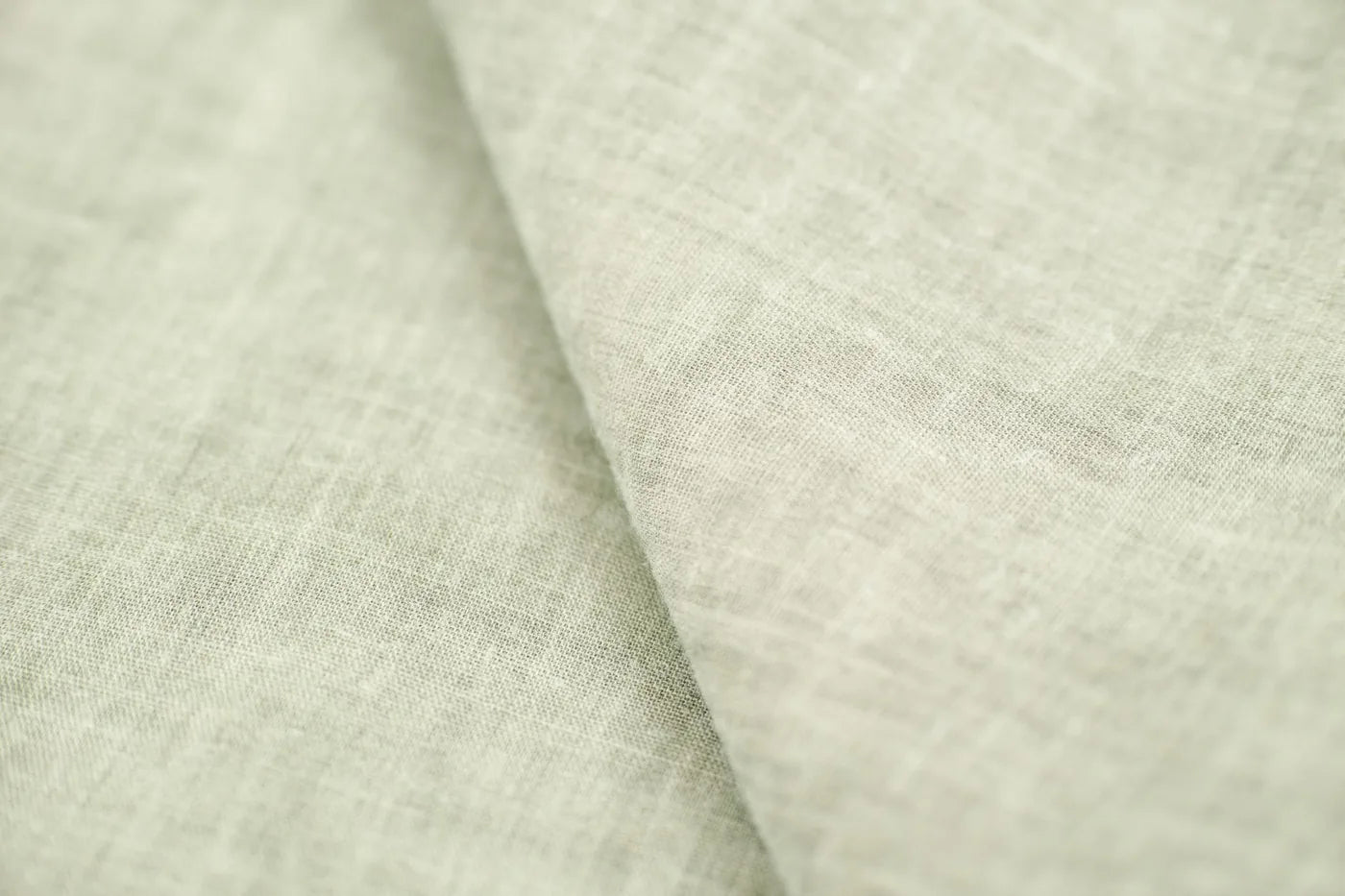 Soft linen and dried botanicals in calm light, gentle postpartum mood.