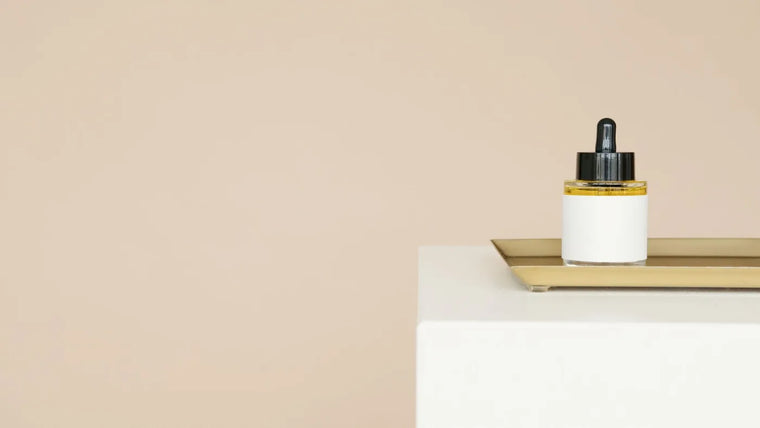 Golden oil in soft neutral light, fatty-acid rich skincare still life.