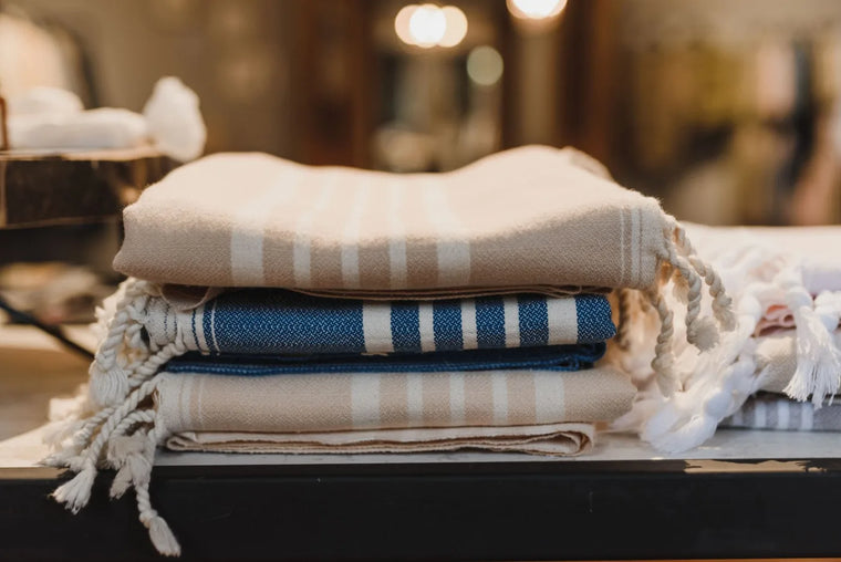 Soft folded cotton in gentle natural light, calm minimal skincare mood.
