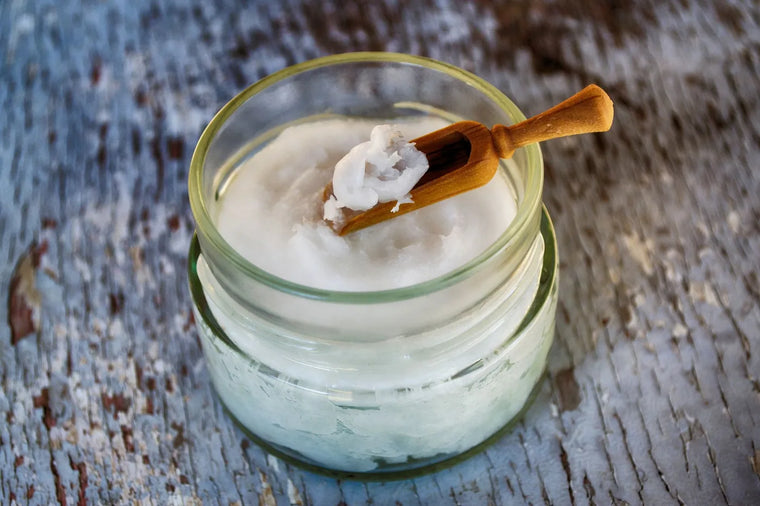 Coconut oil in a glass jar, soft neutral light, natural oils comparison.