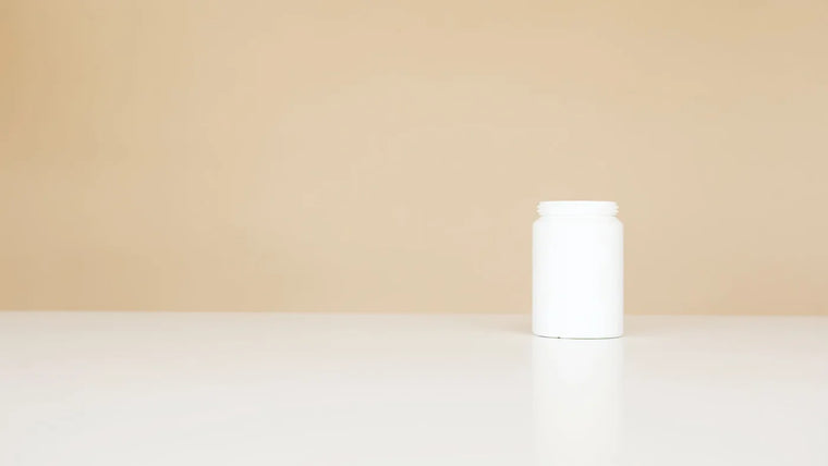 Plain unscented cosmetic jar with soft shadow, fragrance-free skincare still life.