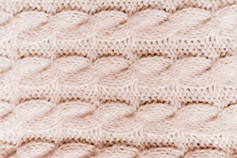 Soft cream texture in warm neutral tones, calming skin-barrier mood.