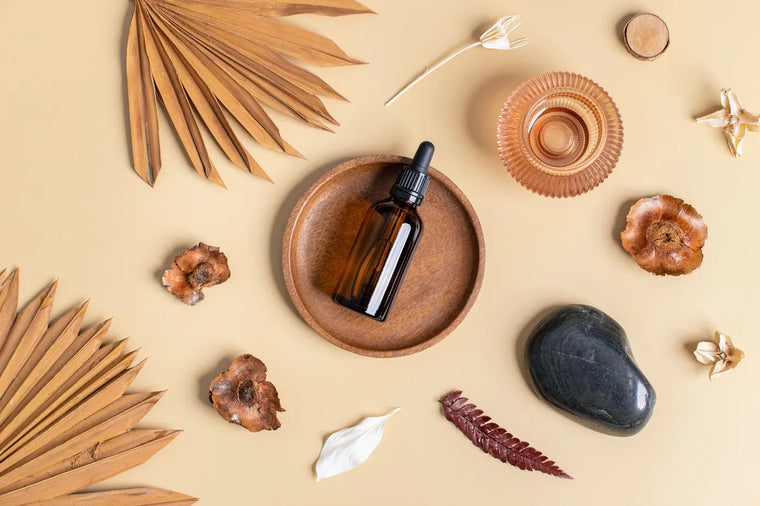 Clear glass dropper bottle in neutral light, skincare formulation still life.