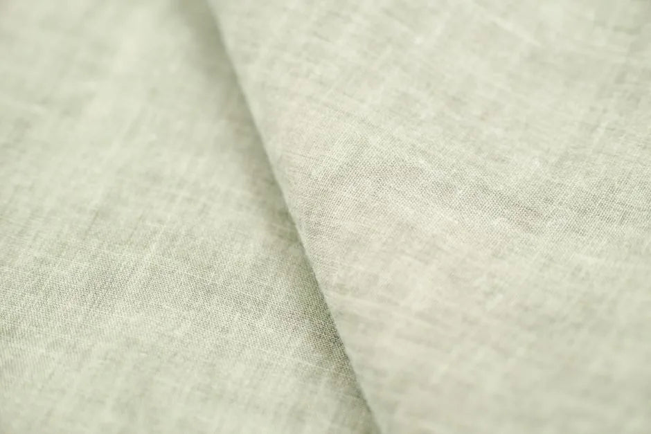 Soft sage linen fabric, gentle tallow skincare for sensitive skin.