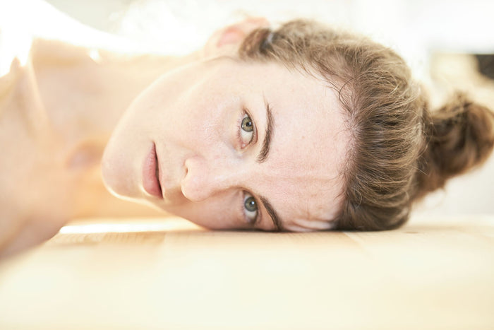 Calm skin in soft diffused light, minimal routine mood.