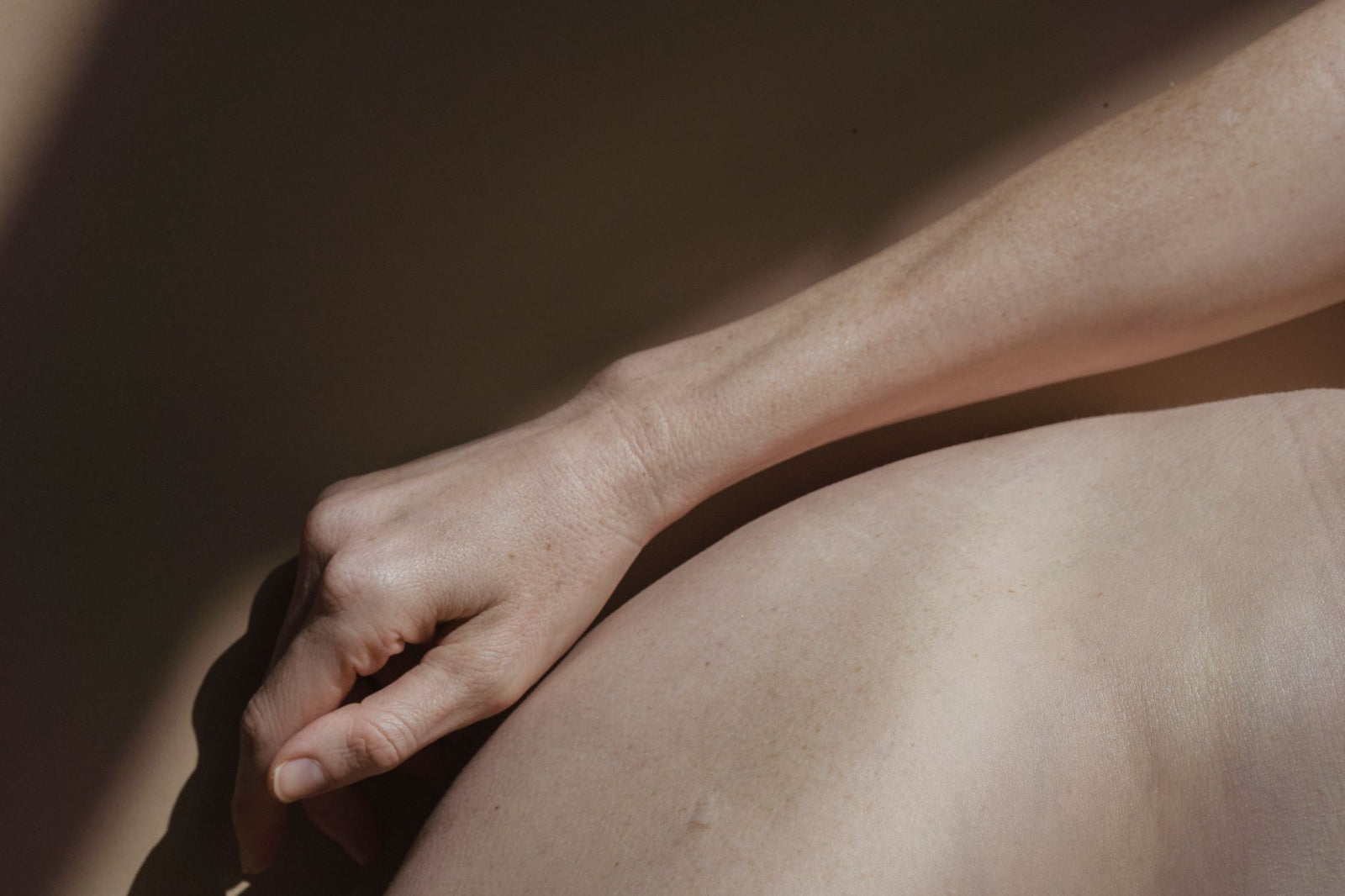 Cool natural light on calm skin, cold-weather exposure mood.